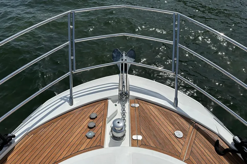 Slide: The Image of Bow of 2013 Azimut Fly 53 yacht with teak decking and stainless steel railings. - 48