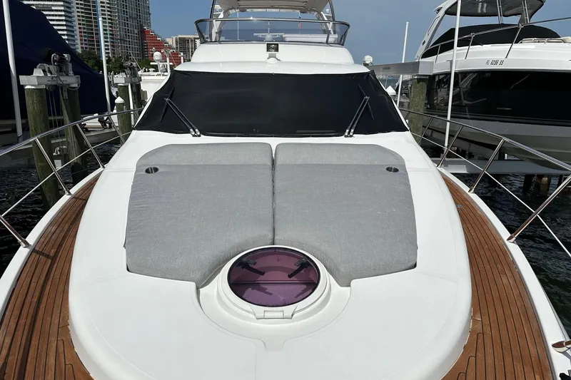 Slide: The Image of 2013 Azimut Fly 53 yacht with sunbathing area, docked at marina. - 49