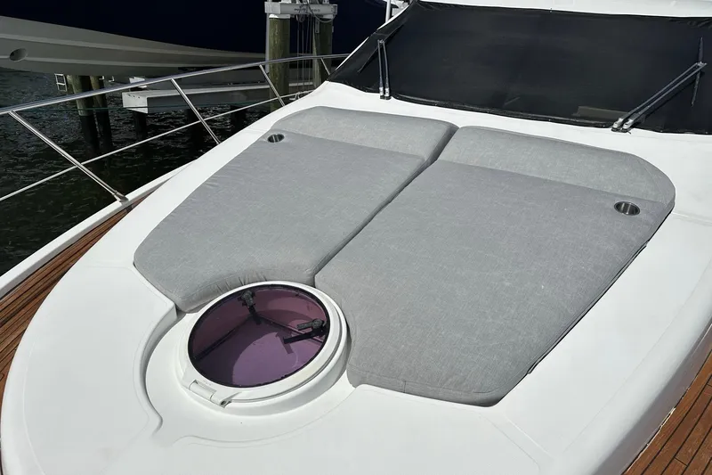 Slide: The Image of Sunbathing deck on 2013 Azimut Fly 53 yacht with cushioned seating and hatch. - 50
