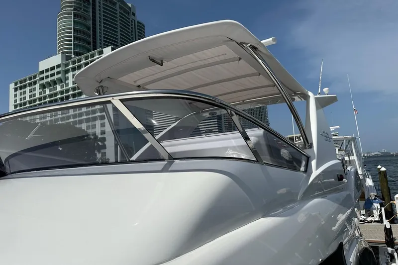 Slide: The Image of Azimut Fly 53 yacht, 2013 model, docked with city skyline in background. - 52