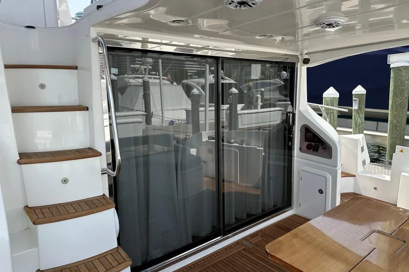 Slide: The Image of Azimut Fly 53 yacht deck with wooden stairs and sliding glass doors, 2013 model. - 56