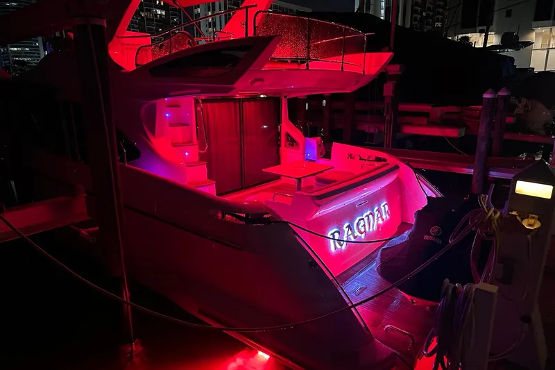 Slide: The Image of Azimut Fly 53 yacht, 2013 model, illuminated with vibrant red lights at night. - 6
