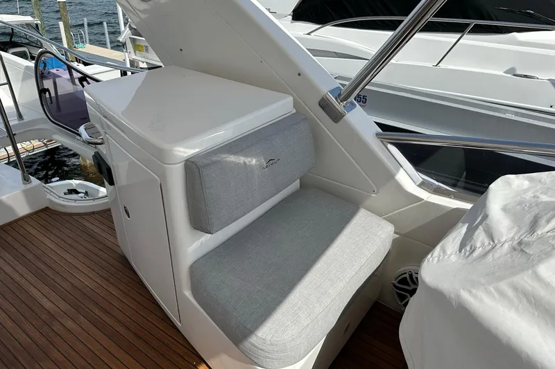 Slide: The Image of Azimut Fly 53 yacht interior, featuring cushioned seating and sleek design, 2013 model. - 65
