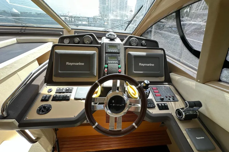 Slide: The Image of Cockpit of 2013 Azimut Fly 53 yacht with Raymarine navigation systems and modern controls. - 74