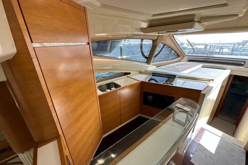 Slide: The Image of Luxurious interior of 2013 Azimut Fly 53 yacht with wooden cabinetry and panoramic windows. - 77