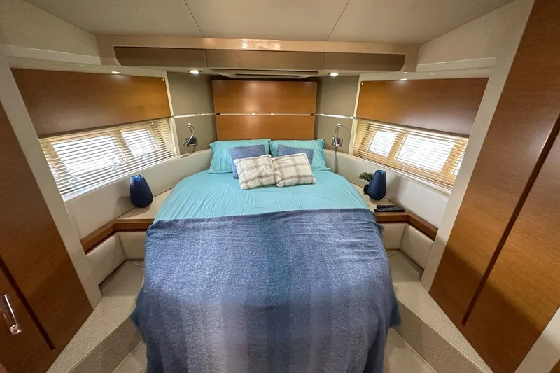 Slide: The Image of Luxurious bedroom interior of 2013 Azimut Fly 53 yacht with modern design and cozy bedding. - 78