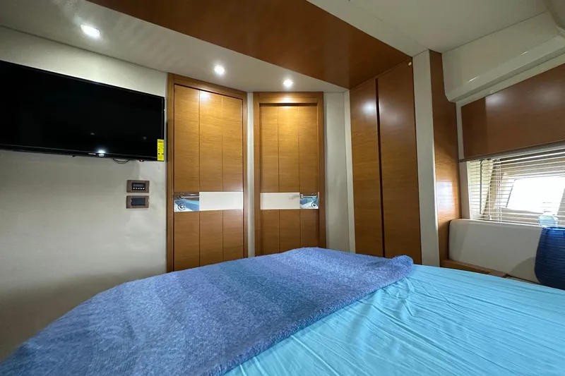 Slide: The Image of Interior of 2013 Azimut Fly 53 yacht bedroom with modern wood paneling and TV. - 81