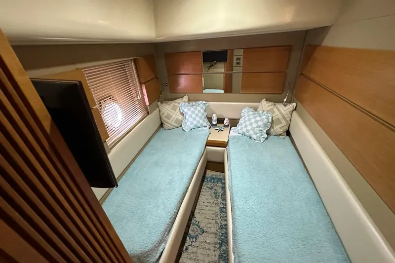 Slide: The Image of Luxurious 2013 Azimut Fly 53 yacht cabin with twin beds and elegant decor. - 83