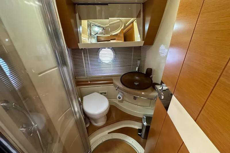 Slide: The Image of Luxurious bathroom in 2013 Azimut Fly 53 yacht with modern fixtures and wood accents. - 85