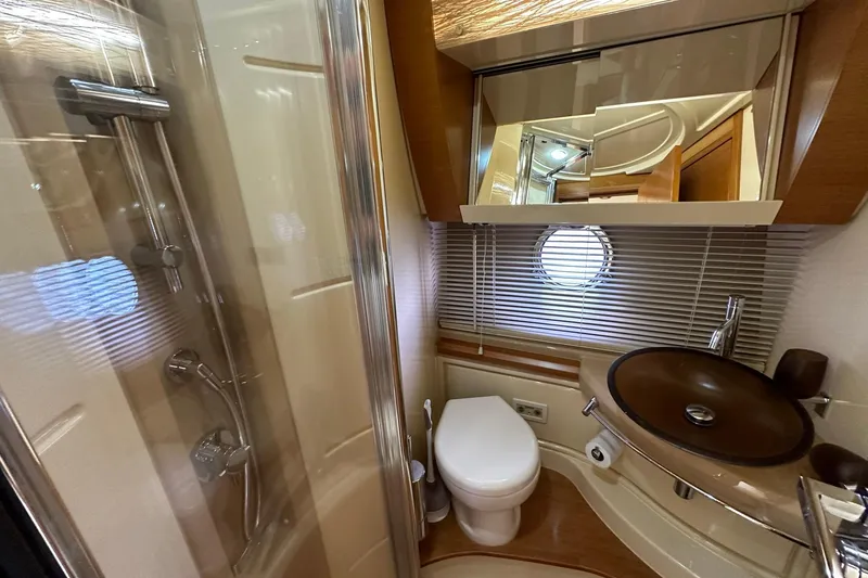 Slide: The Image of Luxurious bathroom in 2013 Azimut Fly 53 yacht with modern fixtures and porthole window. - 86