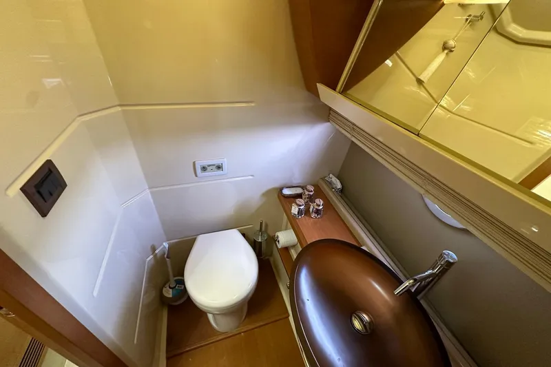 Slide: The Image of Luxurious bathroom in 2013 Azimut Fly 53 yacht with modern sink and toilet. - 89