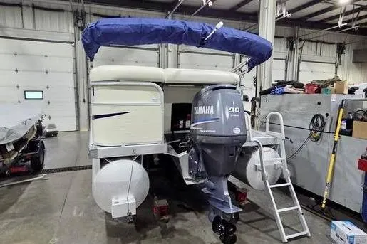 Slide: The Image of 2005 Bennington 205L boat interior with steering wheel and control panel. - 12