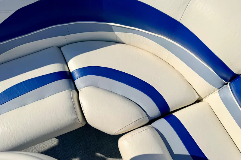 Slide: The Image of White and blue seating on a 2005 Bennington 205L boat. - 25