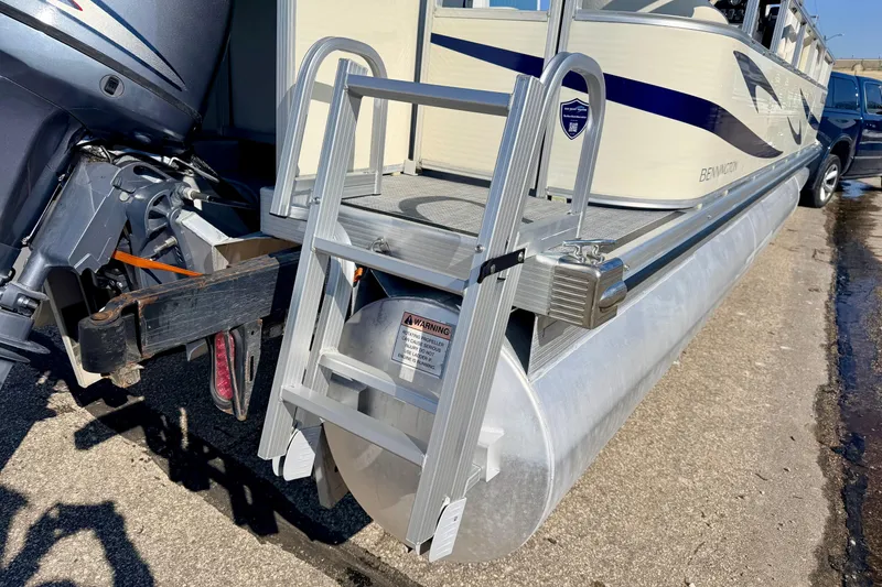 Slide: The Image of 2005 Bennington 205L pontoon boat with ladder and outboard motor on trailer. - 38