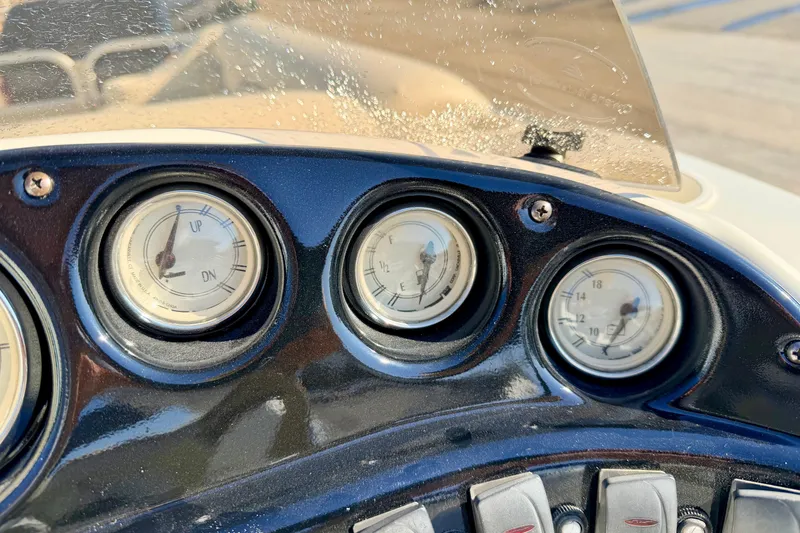 Slide: The Image of Dashboard of a 2005 Bennington 205L boat with gauges and controls. - 40