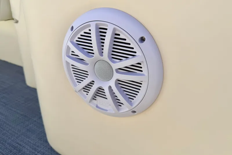 Slide: The Image of Close-up of a speaker on a 2005 Bennington 205L boat interior. - 47