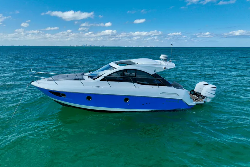 The Image of 2012 Beneteau Gran Turismo 34 yacht on open sea under blue sky. - 1