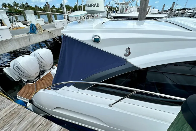 Slide: The Image of 2012 Beneteau Gran Turismo 34 yacht docked with Yamaha outboard engines. - 11