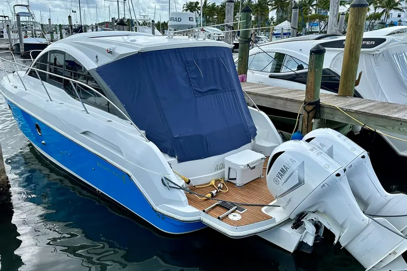 Slide: The Image of 2012 Beneteau Gran Turismo 34 yacht docked with Yamaha outboard engines. - 13
