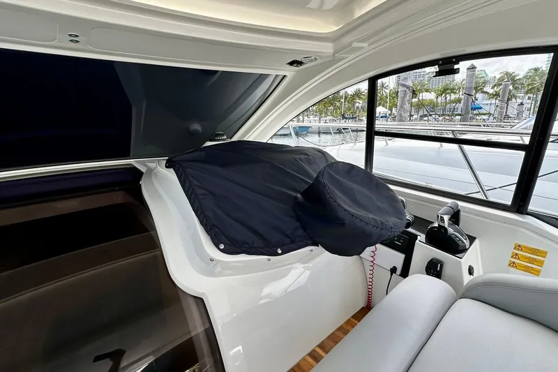 Slide: The Image of Interior view of 2012 Beneteau Gran Turismo 34 yacht cockpit with covered steering wheel. - 16
