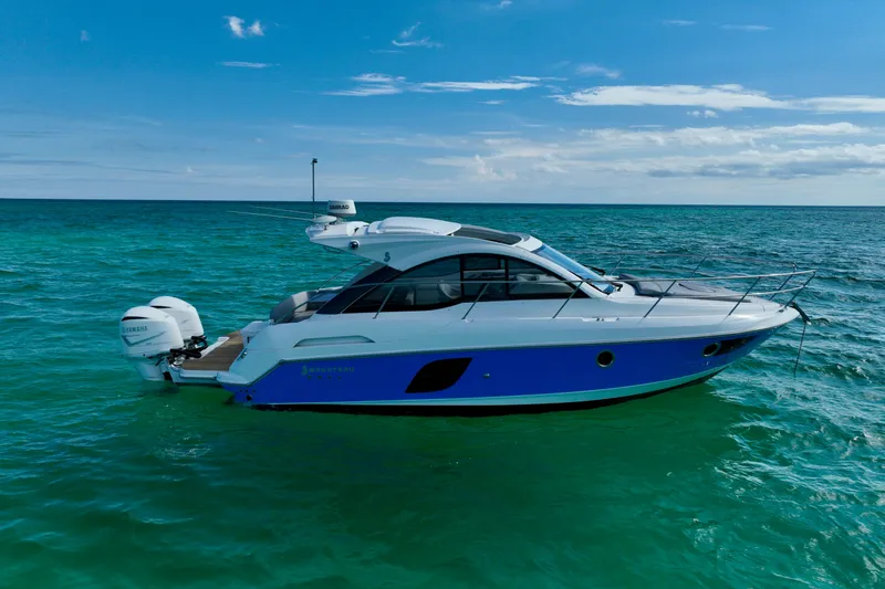 Slide: The Image of 2012 Beneteau Gran Turismo 34 yacht on turquoise ocean under blue sky. - 2