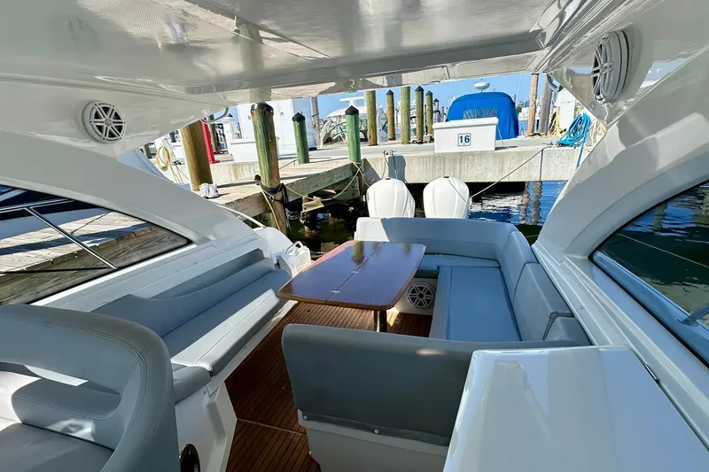 Slide: The Image of Luxurious 2012 Beneteau Gran Turismo 34 yacht interior with seating and table at marina. - 24