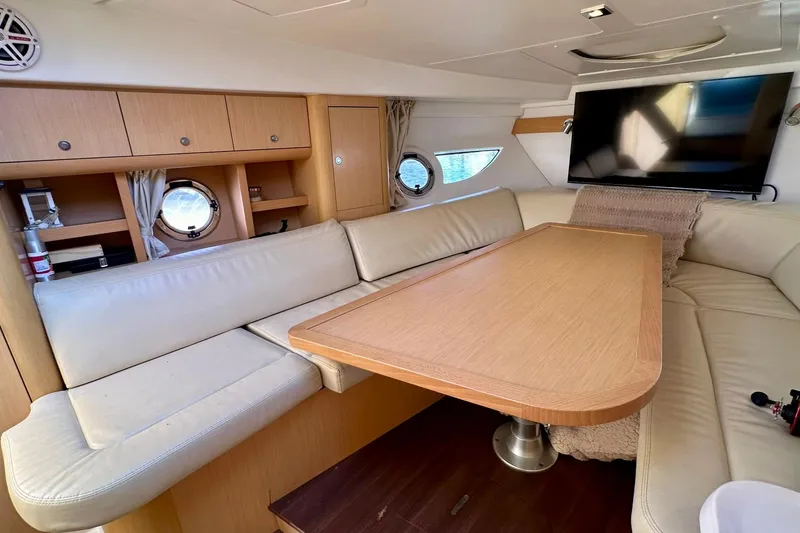 Slide: The Image of Interior of 2012 Beneteau Gran Turismo 34 yacht with cozy seating and modern amenities. - 28