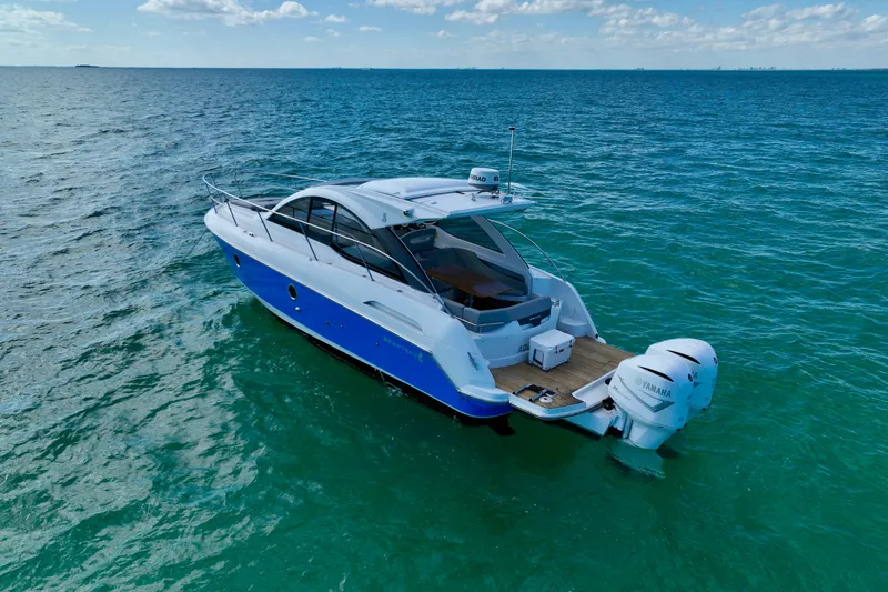 Slide: The Image of 2012 Beneteau Gran Turismo 34 yacht cruising on open sea with Yamaha engines. - 4