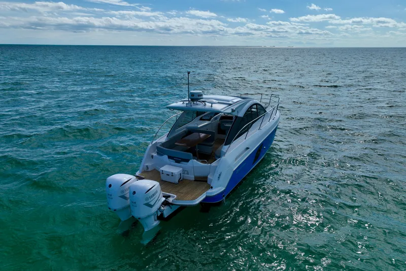 Slide: The Image of 2012 Beneteau Gran Turismo 34 yacht cruising on open sea under clear sky. - 6
