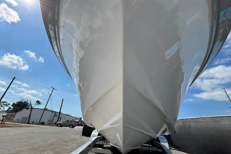 Slide: The Image of 2022 Sea Fox 206 Commander boat hull under bright blue sky. - 12