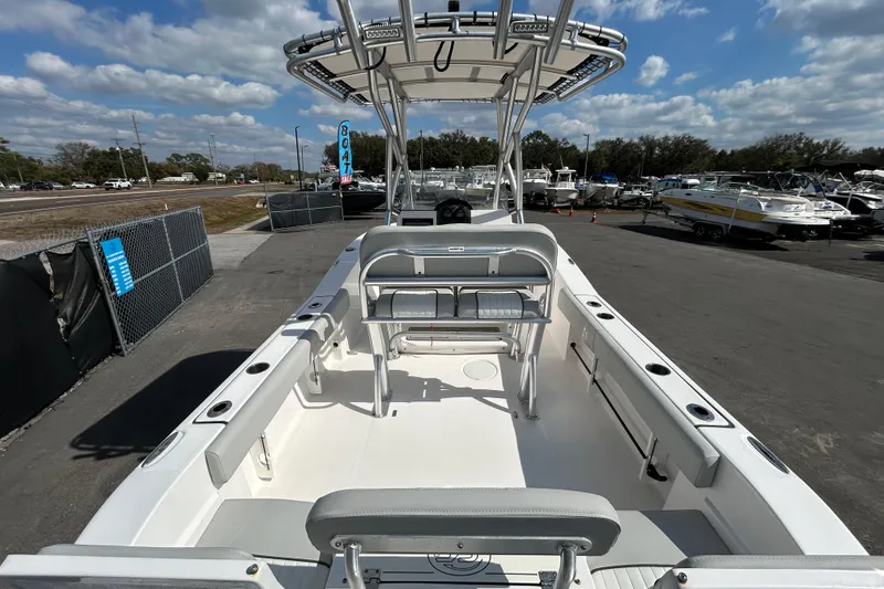 Slide: The Image of 2022 Sea Fox 206 Commander boat interior with seating and console, displayed outdoors. - 15