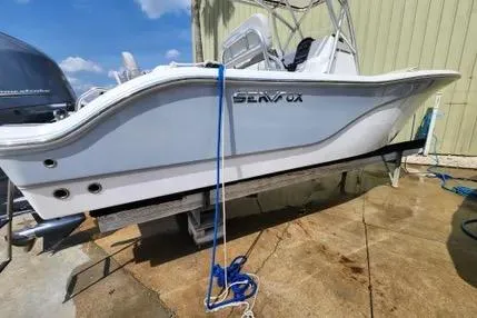 Slide: The Image of 2022 Sea Fox 206 Commander boat with Yamaha engine on trailer under blue sky. - 2