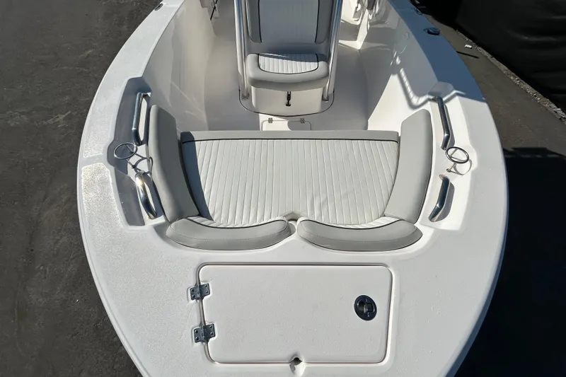 Slide: The Image of 2022 Sea Fox 206 Commander boat interior with white seating and storage compartment. - 23