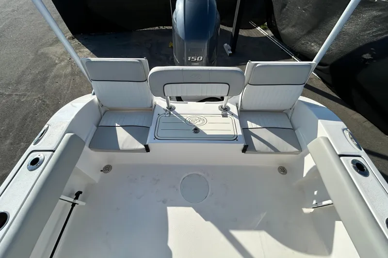 Slide: The Image of 2022 Sea Fox 206 Commander boat interior with seating and motor view. - 29