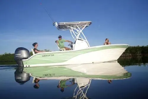 Slide: The Image of 2022 Sea Fox 206 Commander boat with Yamaha 150 engine, parked outdoors under blue sky. - 3