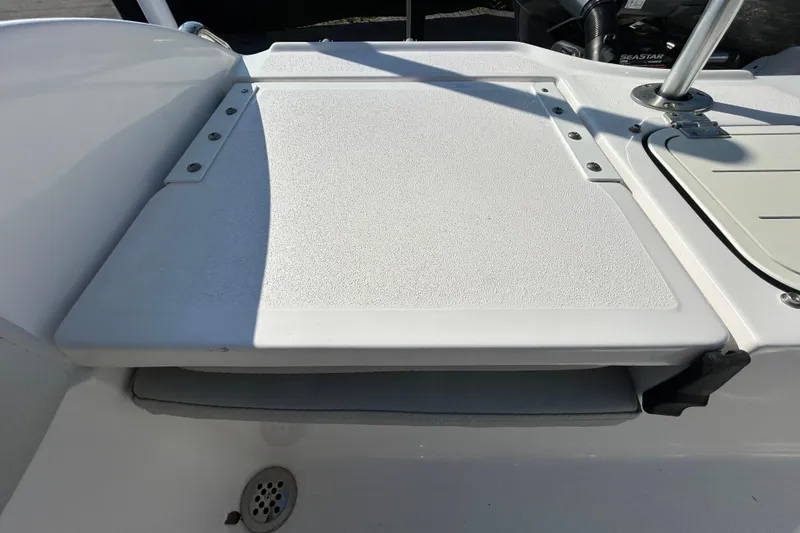 Slide: The Image of 2022 Sea Fox 206 Commander boat deck with textured surface and drain. - 31