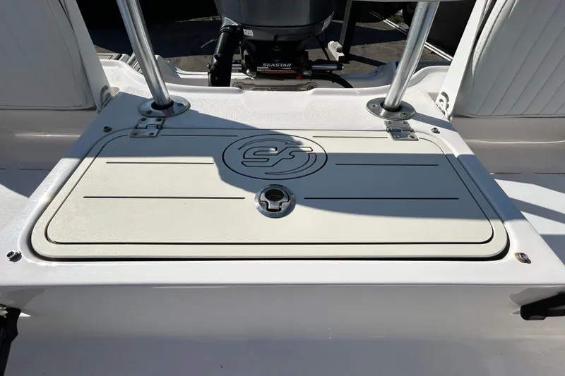 Slide: The Image of 2022 Sea Fox 206 Commander boat deck with storage compartment and support poles. - 38