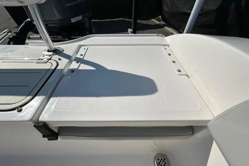 Slide: The Image of 2022 Sea Fox 206 Commander boat deck with storage compartment and drain. - 41