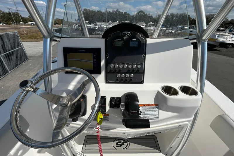 Slide: The Image of 2022 Sea Fox 206 Commander boat dashboard with steering wheel and control panel. - 48