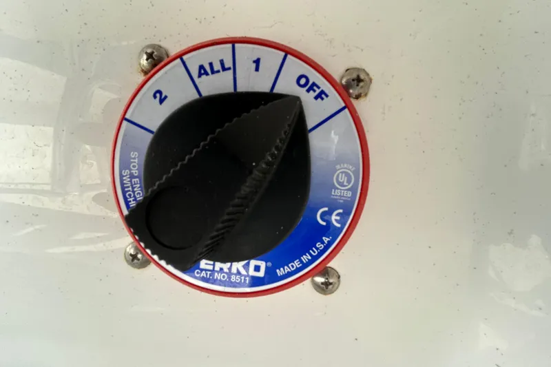 Slide: The Image of Boat battery switch on a 2022 Sea Fox 206 Commander, labeled "Perko" with settings 0-2. - 49