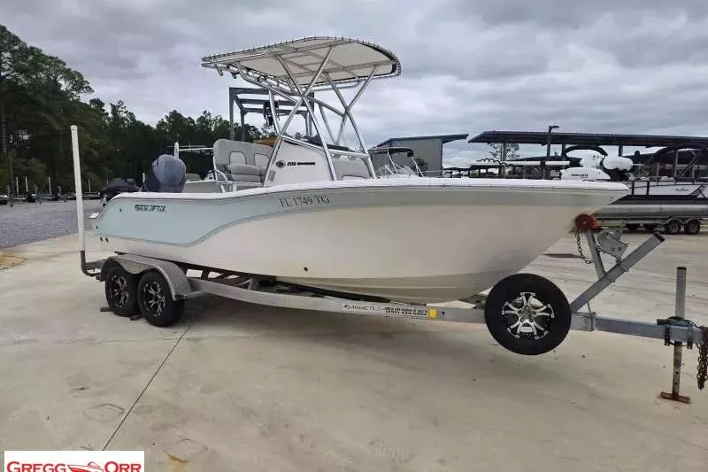 Slide: The Image of 2022 Sea Fox 206 Commander boat on trailer, showcasing outboard motor and hull. - 5