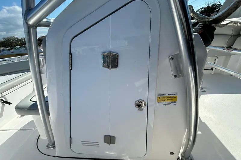 Slide: The Image of 2022 Sea Fox 206 Commander boat console with storage compartment and capacity label. - 53