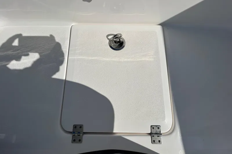 Slide: The Image of 2022 Sea Fox 206 Commander boat hatch with metal latch and shadow. - 56