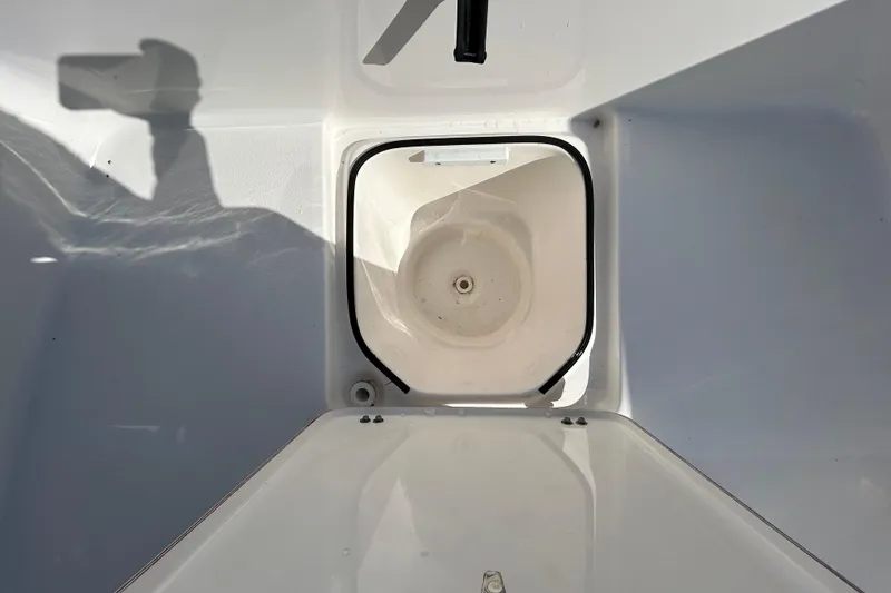 Slide: The Image of 2022 Sea Fox 206 Commander boat storage compartment with open hatch, showing interior details. - 57
