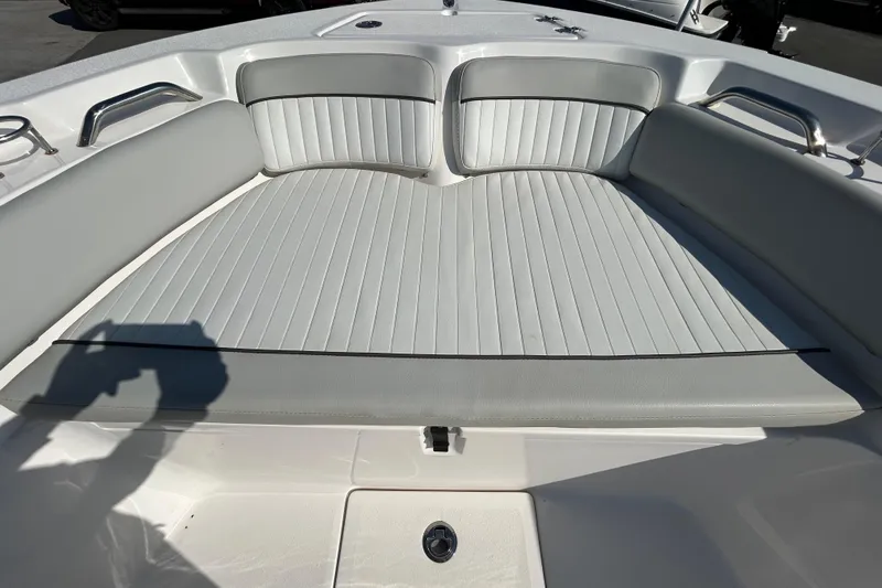 Slide: The Image of 2022 Sea Fox 206 Commander boat interior with cushioned seating and stainless steel handles. - 59