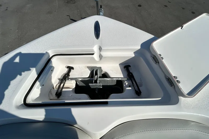 Slide: The Image of Anchor storage compartment on 2022 Sea Fox 206 Commander boat, open lid, sunny day. - 63