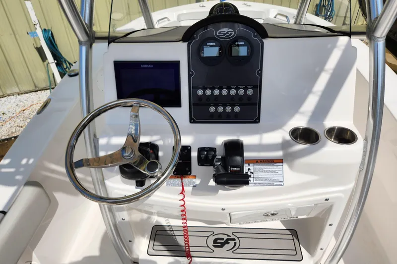 Slide: The Image of 2022 Sea Fox 206 Commander boat on trailer under a sunny sky. - 8