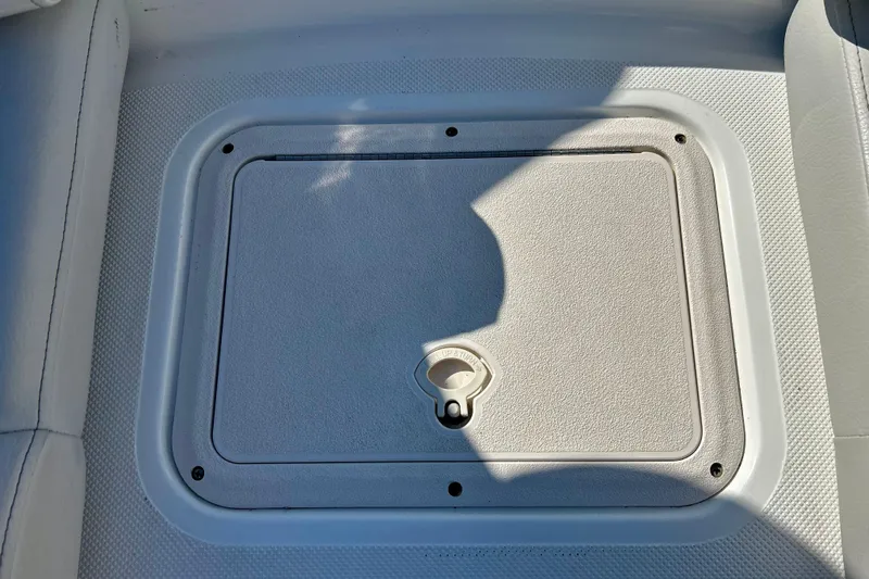 Slide: The Image of 2019 Hurricane SunDeck Sport 201 OB boat storage compartment with latch. - 22