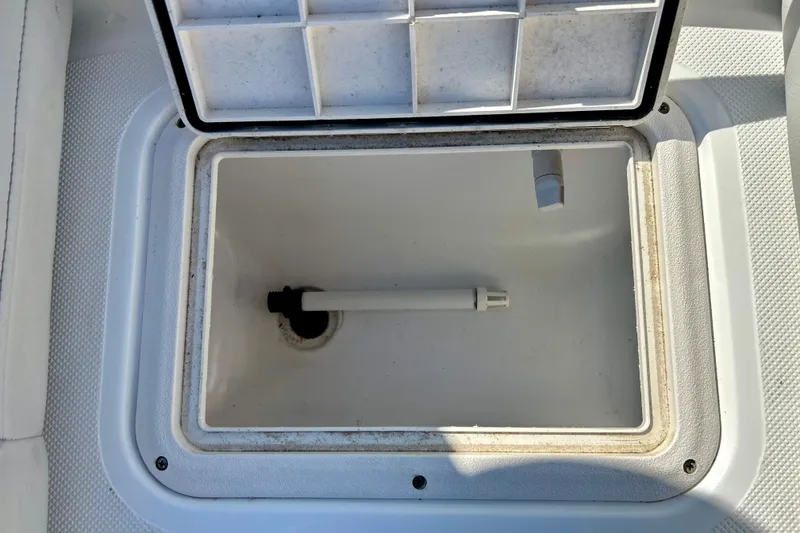 Slide: The Image of Open storage compartment on 2019 Hurricane SunDeck Sport 201 OB boat. - 23