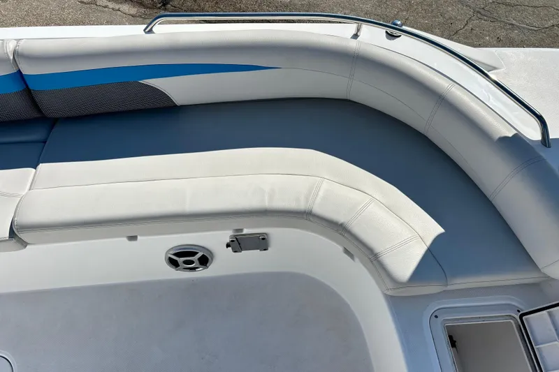 Slide: The Image of 2019 Hurricane SunDeck Sport 201 OB boat interior with cushioned seating and speaker. - 24